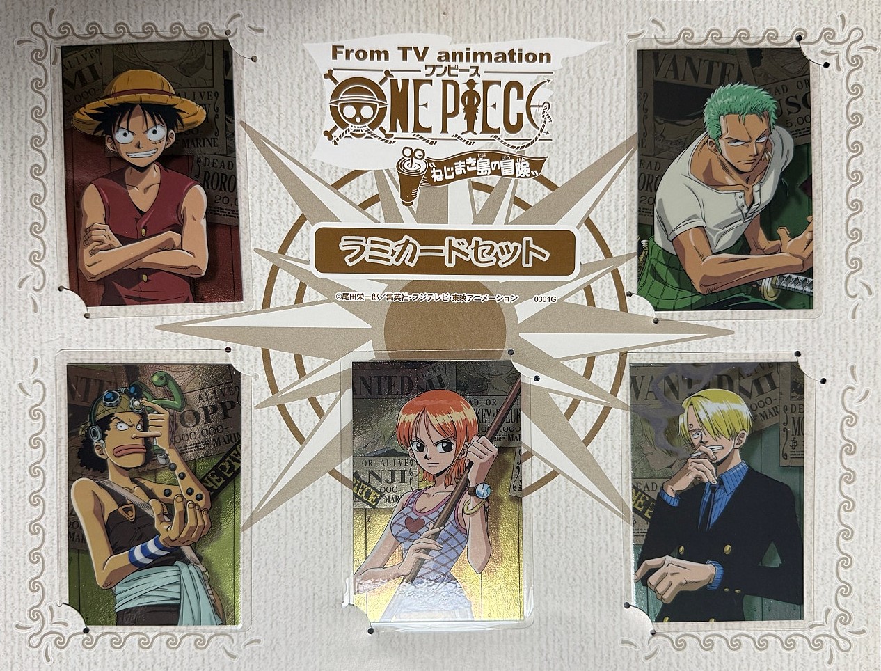 The five lami cards mounted in the printed starburst display board