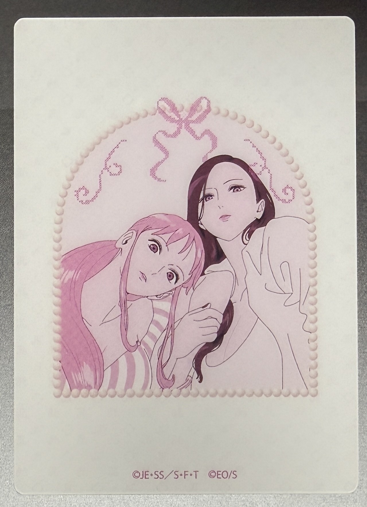 Nami and Robin pair clear card inside a pearl-beaded arch