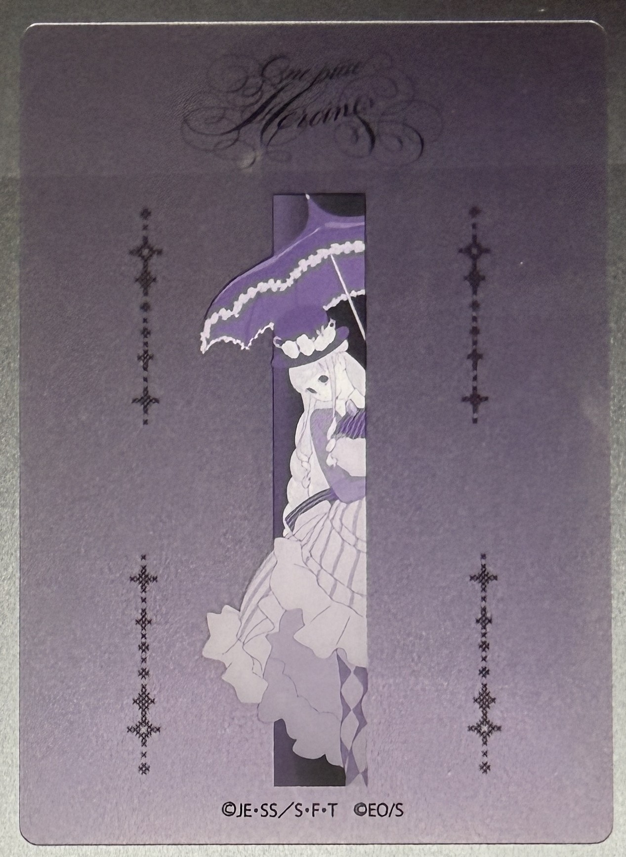 Perona clear card, parasol design seen through a narrow vertical window