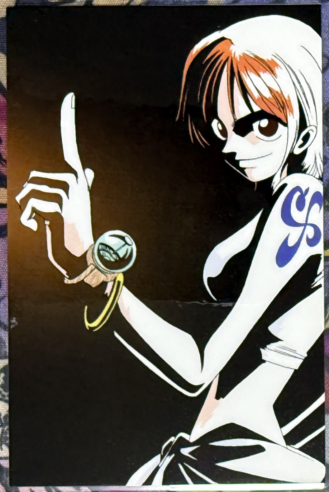 Nami lami card front, pointing up with Log Pose on her wrist